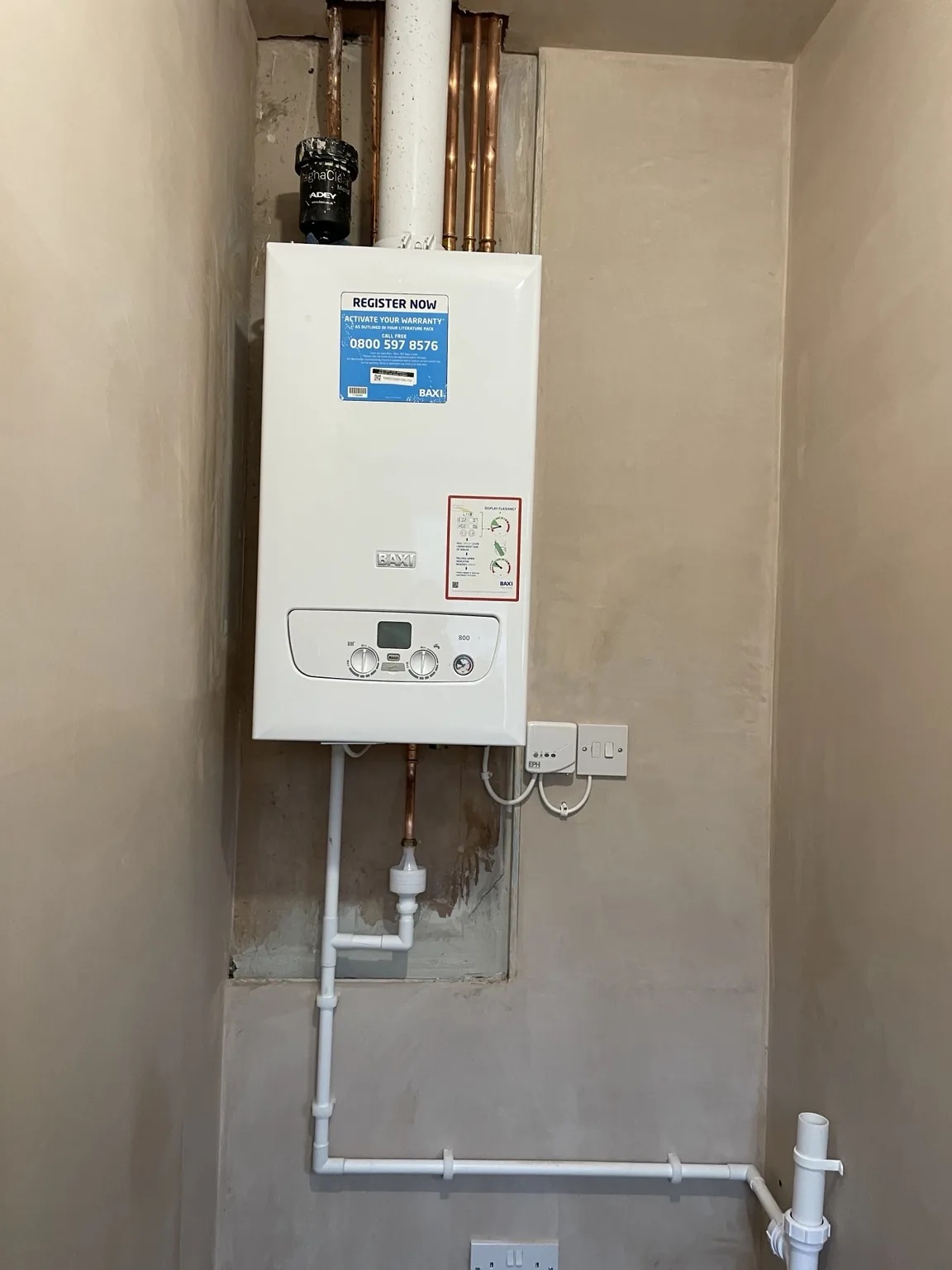 Boiler installation with concealed pipework