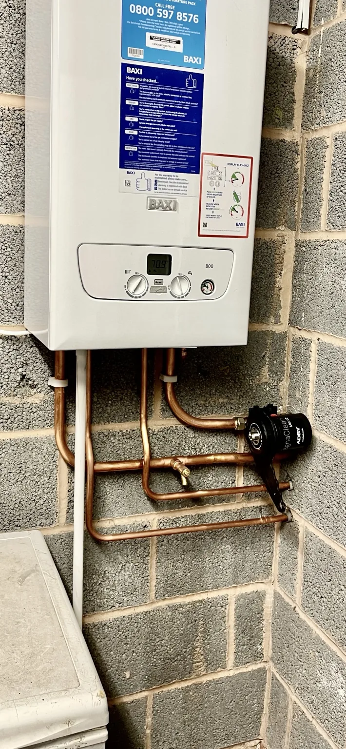 Boiler installation on a brick wall